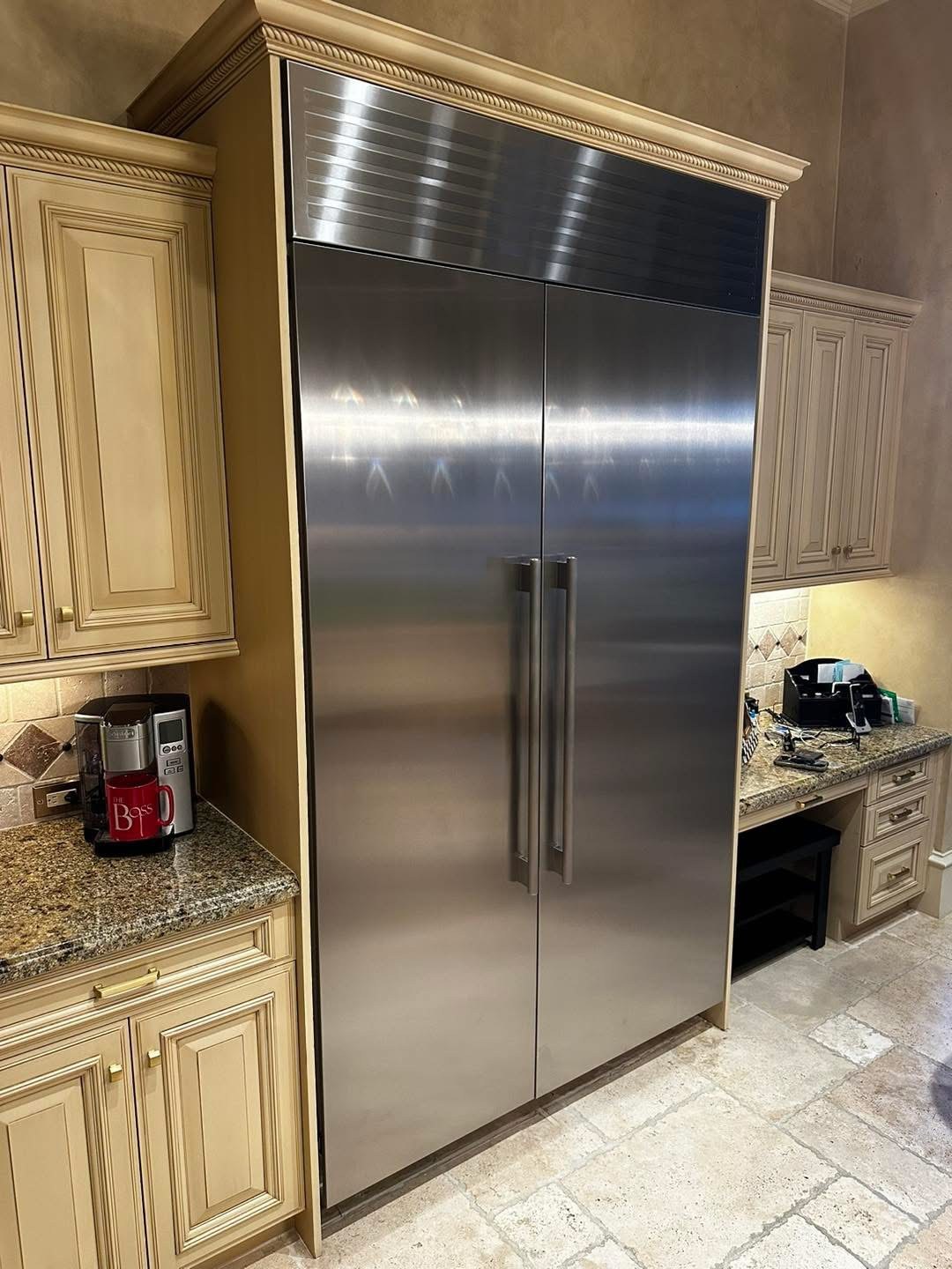 Two refrigeration columns with a custom stainless grille above them